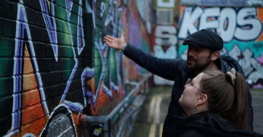 Urban Canvas: Exploring Shoreditch's Vibrant Street Art - The spray-painting session adds more than a photo stop
